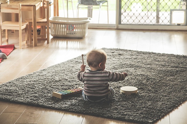 baby playing music instrument